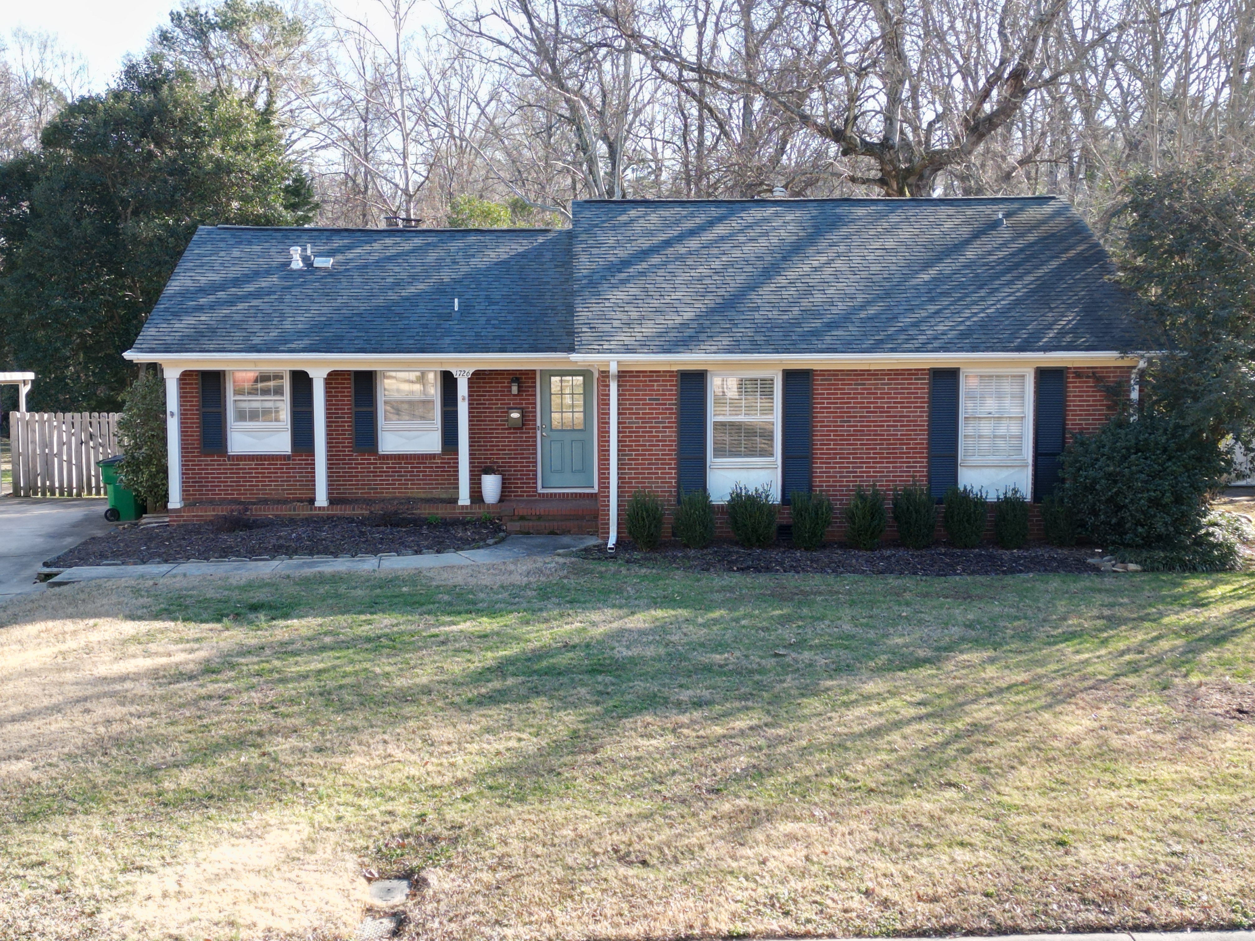 Brick Ranch in Starmount neighborhood on half acre lot with a fenced in backyard
